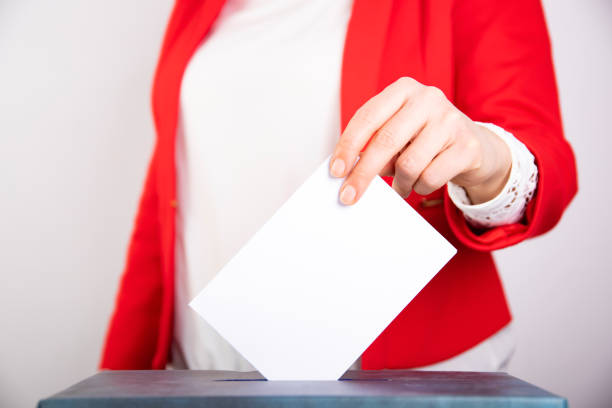 istock Woman votes on election day. 1214885142