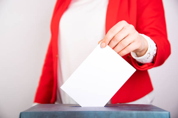 istock Woman votes on election day. 1214885570