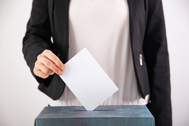 istock Woman votes on election day. 1214886534