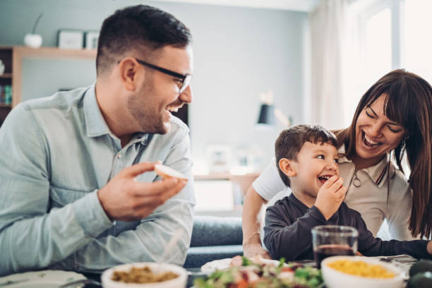 istock Young family having lunch together 1214886809