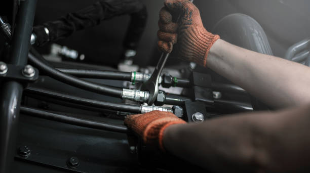 Banner with close up view of hydraulic pipes of heavy industry machine. Low key. Close up view of hydraulic pipes of heavy industry machine. Low key. Hydraulic maintenance concept. hydraulic hose stock pictures, royalty-free photos & images