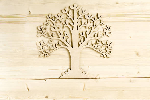 Wooden tree symbol on wood texture with copy space.