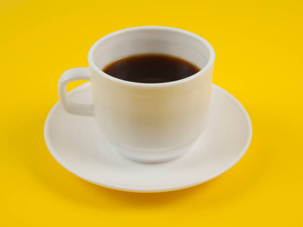 istock Top view image of coffee cup on yellow background flat lay copy space 1214890704
