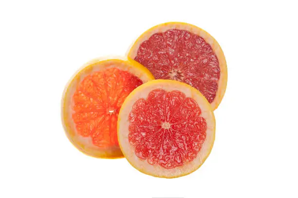 Photo of Grapefruit citrus fruit halves isolated on white background slices of grapefruit with clipping path