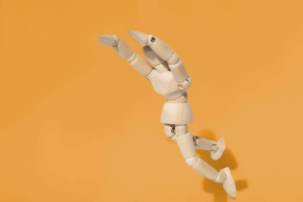 istock Wooden Dummy Jumps Head First 1214892848