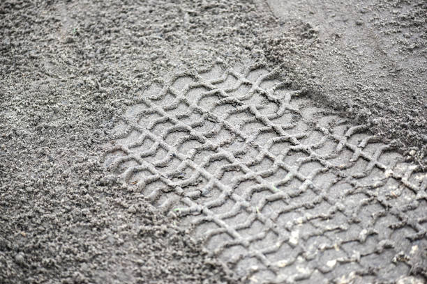 istock Wheel track on earth or mud from big vehicle. 1214893126