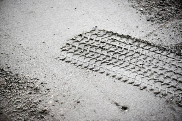 istock Wheel track on earth or mud from big vehicle. 1214893127