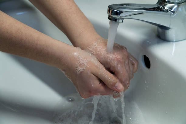 istock Rubbing Hands With Soap In Order To Wash Them 1214893238