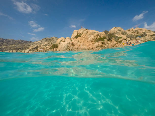 Beautiful smooth eroded granite rocks and green Mediterranean water in Sardinia, Sardinia, Italy.