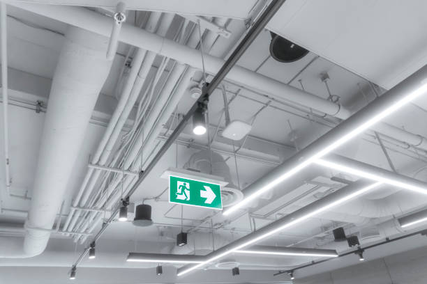 istock Large white pipes inside the building. modern electric system and air system in the building. 1214896741