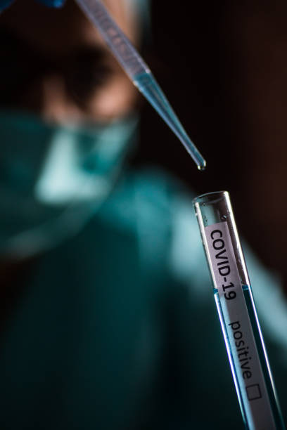 istock Doctor taking samples from coronavirus COVID-19 test tube 1214899555