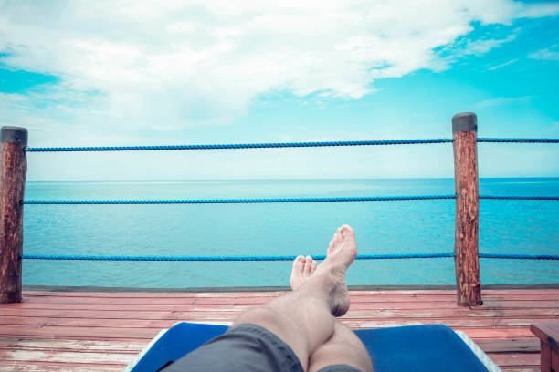 Men enjoing in view on sea from hotel terrace