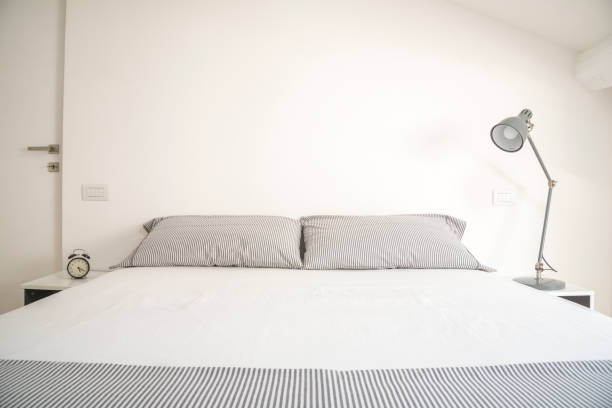 istock white design bedroom in a modern house 1214900024
