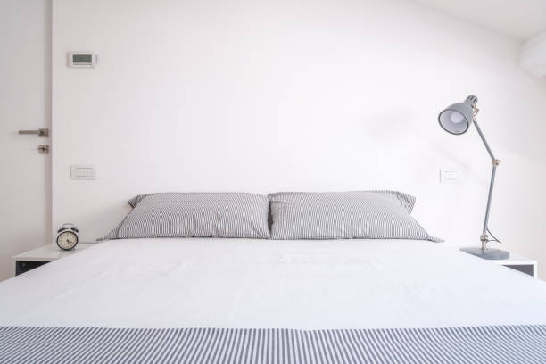 istock white design bedroom in a modern house 1214900765