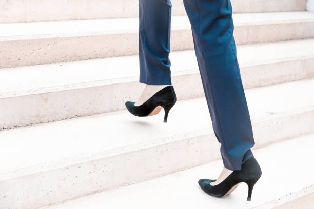 istock Businesswoman walking upstairs 1214901007