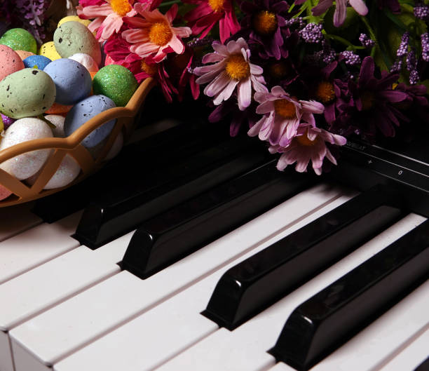istock Paschal Easter Eggs and Piano Keys and Flowers 1214901663
