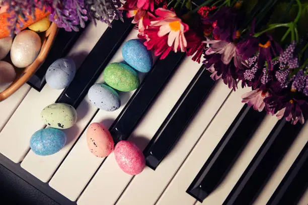 Photo of Paschal Easter Eggs and Piano Keys and Flowers