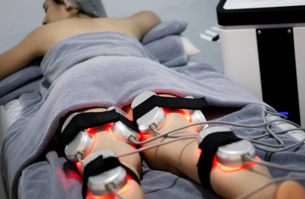 istock Woman doing service with new technology hardware cosmetology, Young woman getting fat removing 1214902829