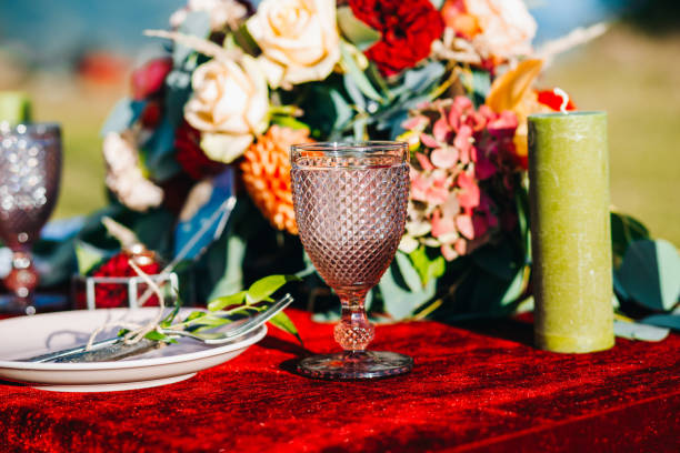 istock Newlyweds table decorated in rustic style on a background of autumn mountains 1214904204