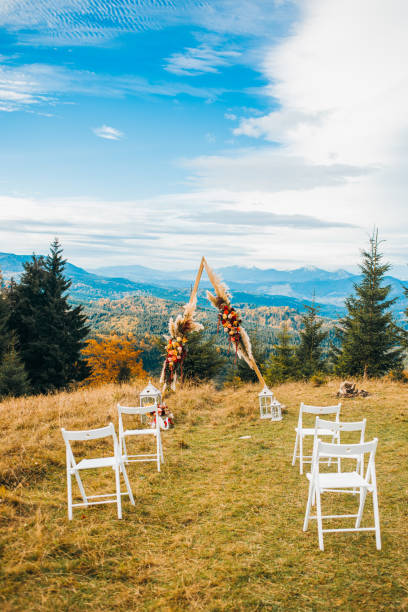 istock Wedding ceremony in stylish rustic style on autumn mountain landscapes 1214904389