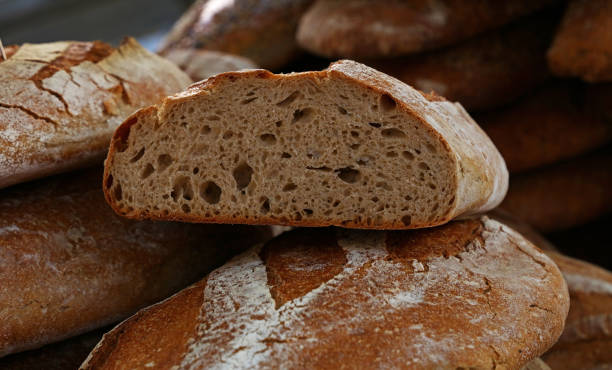 istock Close up fresh bread loaves on retail display 1214904407