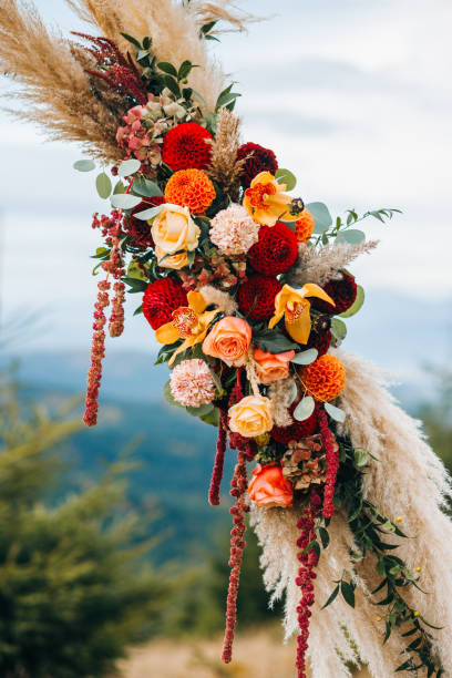 istock Elements of wedding arch in rustic style on mountains background 1214904481