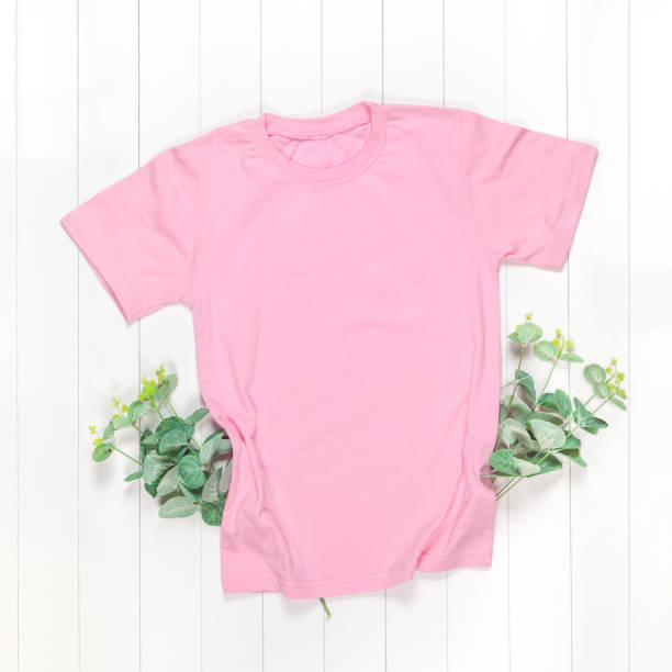 istock Pink t-shirt with short sleeves and green branches 1214904593