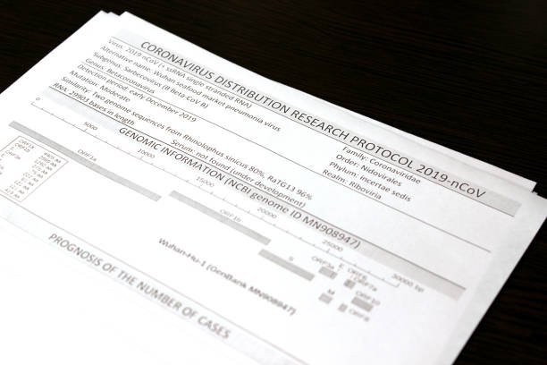 istock Coronavirus distribution research protocol 2019-nCoV. Information sheets of paper lie on a black surface. 1214907483