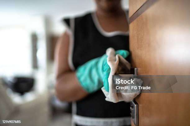 Hands With Glove Wiping Doorknob Stock Photo - Download Image Now - Cleaning, Cleaner, Housework