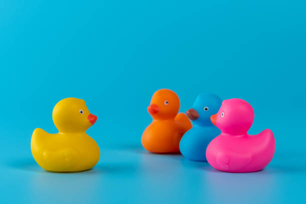 istock Colorful rubber ducks on blue background. Summer minimal concept. 1214909312