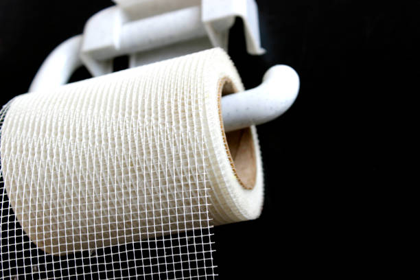istock Plan B or alternatives concept. Wrong choice. A roll of white mesh looks like toilet paper. Black background. 1214909628