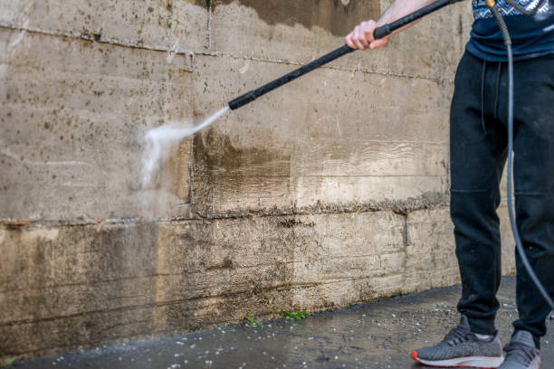 istock Cleaning concrete wall with high pressure 1214910484