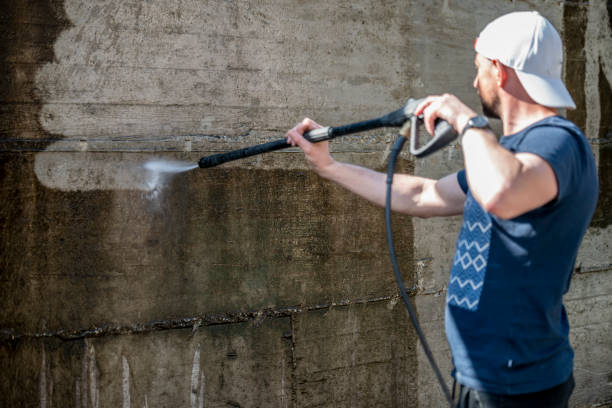 istock Cleaning concrete wall with high pressure 1214910495