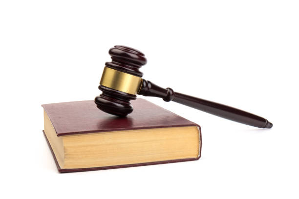 istock Wooden judges gavel on white background in close up. Space for text 1214911049