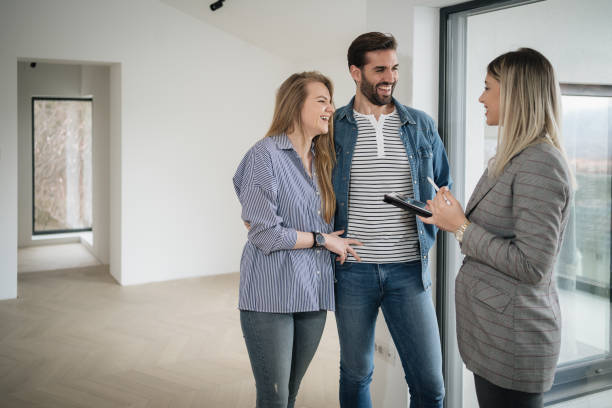 istock Young couple getting tour through apartment they consider buying 1214912096