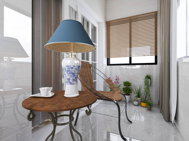 istock 3D rendering, spacious and bright urban residential closed balcony design, green plants with wooden tables and chairs are leisure and comfortable. 1214912185