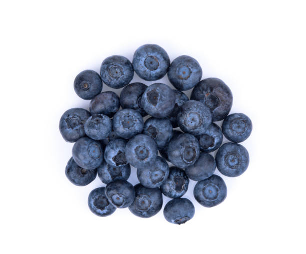 istock blueberries isolated on white background, top view, flat lay 1214912453