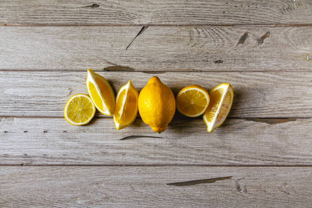 istock fresh sliced lemon on wooden natural background 1214912456