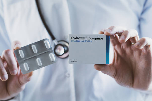istock Doctor holding Hydroxychloroquine drug 1214912928