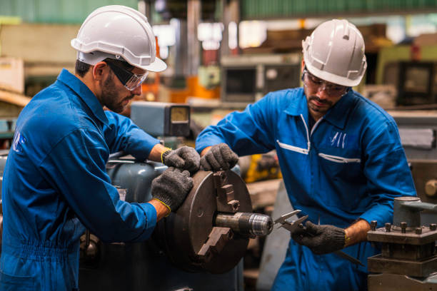 professional technicians and engineers are working in industrial plants that work on steel. - flange imagens e fotografias de stock