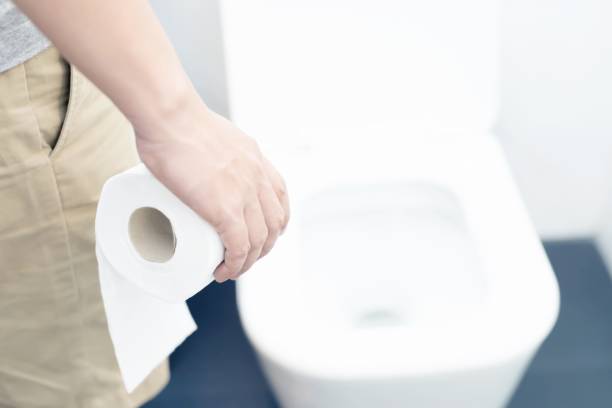 istock A man has a stomach ache, excreting in the bathroom. 1214914184