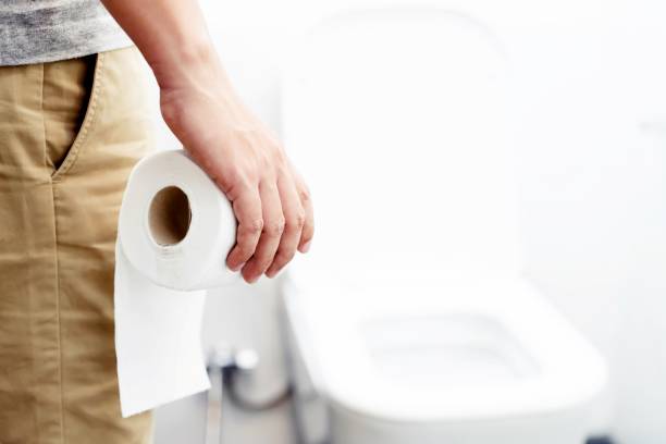 istock A man has a stomach ache, excreting in the bathroom. 1214914214