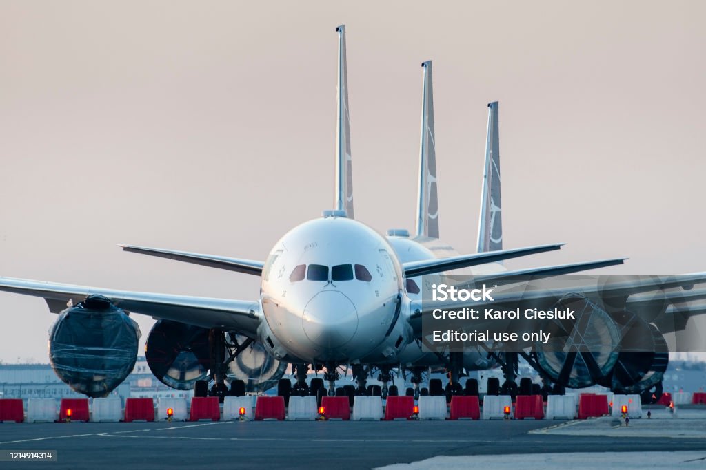 Airlines Coronavirus, grounded airplanes LOT Polish Warsaw, Poland -17/03/2020: Airlines Coronavirus, LOT Polish Airlines Boeing 787's grounded at Warsaw chopin Airport due to the global pandemic Airplane Stock Photo