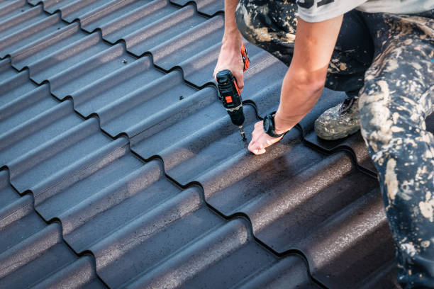 istock the worker screws the metal tile 1214914921