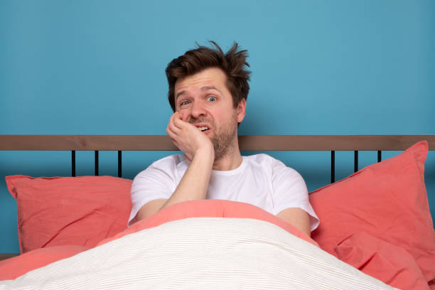 istock man in is exhausted with insomnia or illness being in depression 1214915785