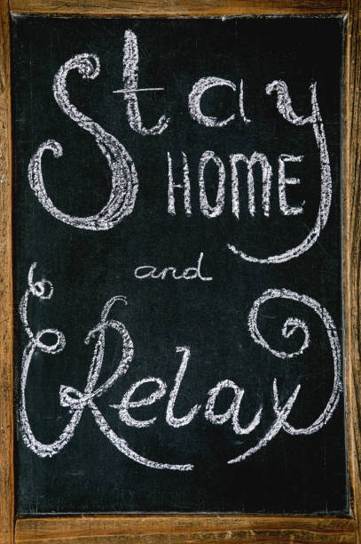 istock Stay home and relax lettering 1214915810