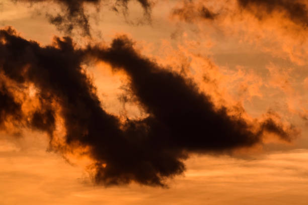 istock Beautiful orange sunstet with heavy or black clouds 1214918339