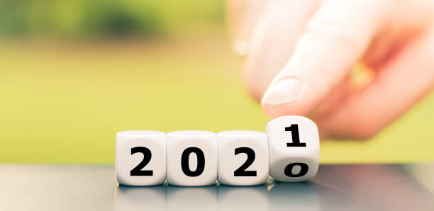 istock Hand turns dice and changes the year 