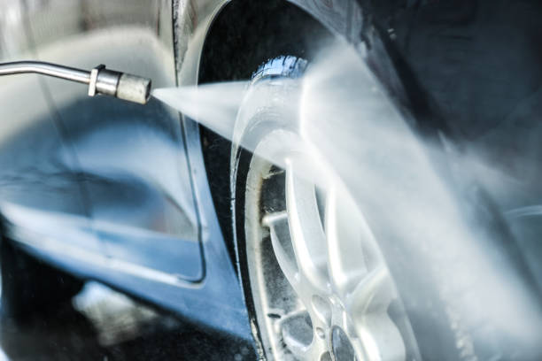 istock Car wash or cleaning with hight pressured water and using foam. 1214918759