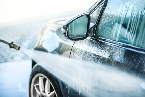 istock Car wash or cleaning with hight pressured water and using foam. 1214918762